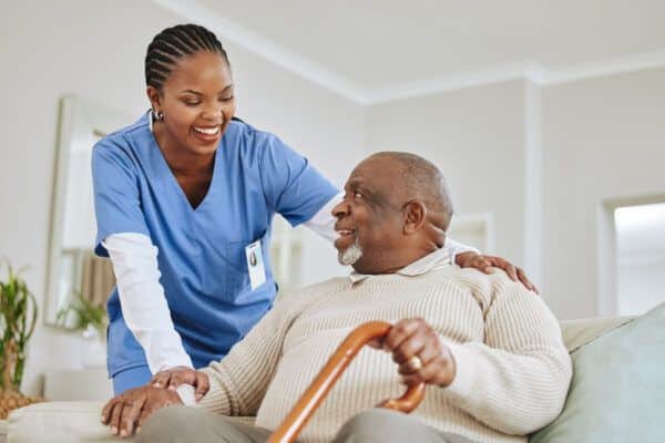 A care worker helping an elderly patient